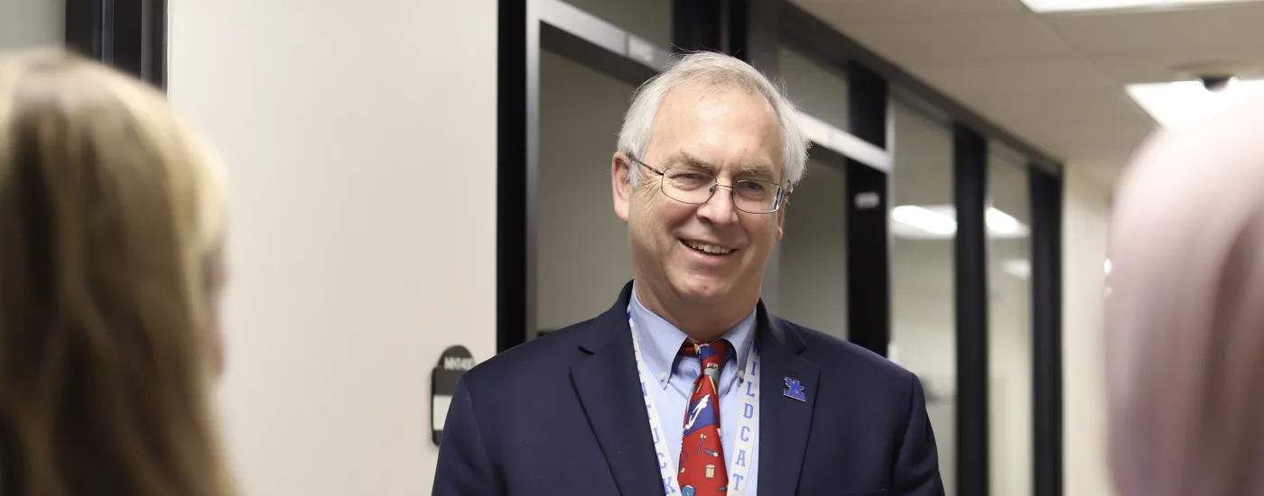dean giffith smiling at students